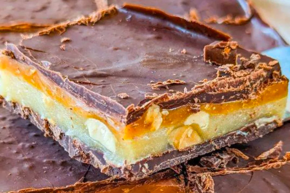 Snickers Fudge is a decadent treat that brings together the rich, creamy textures of fudge with the nutty, caramel goodness of Snickers bars. This layered dessert features a mix of butterscotch or peanut butter chips, semi-sweet chocolate, peanut butter, marshmallow cream, caramels, and salted peanuts. Perfect for parties, holidays, or a special treat, this recipe is sure to impress your family and friends.