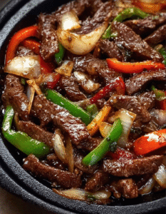 Flavorful Chinese Pepper Steak Stir-Fry: A Sizzling Fusion of Tender Beef and Caramelized Onions