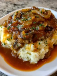 Salisbury Steak with Garlic Mashed Potatoes and Mushroom Onion Gravy
